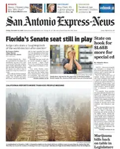 the San Antonio Express-News — a California wildfire burning after dark in a photograph by Josh Edelson