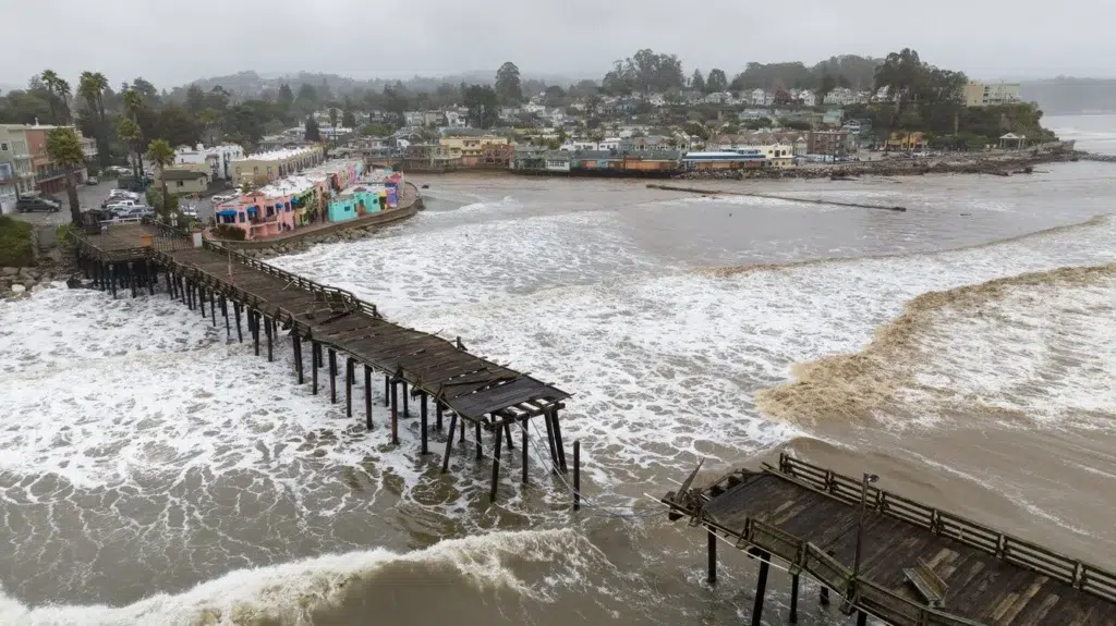 Capitola Village and wharf: Storm-smashed then, storm-smashed now, photo by Josh Edelson/AFP