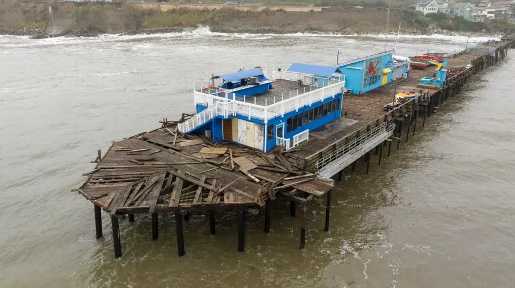 Drone video shows Santa Cruz Wharf collapse, photo by Josh Edelson/AFP