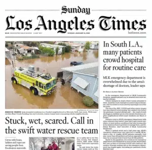 the Los Angeles Times — a wall of wildfire flames, captured by Josh Edelson