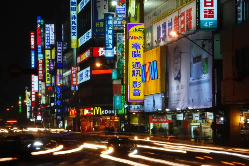 Neon Sign, Zebra crossing, Street light, documentary photography by Josh Edelson/AFP