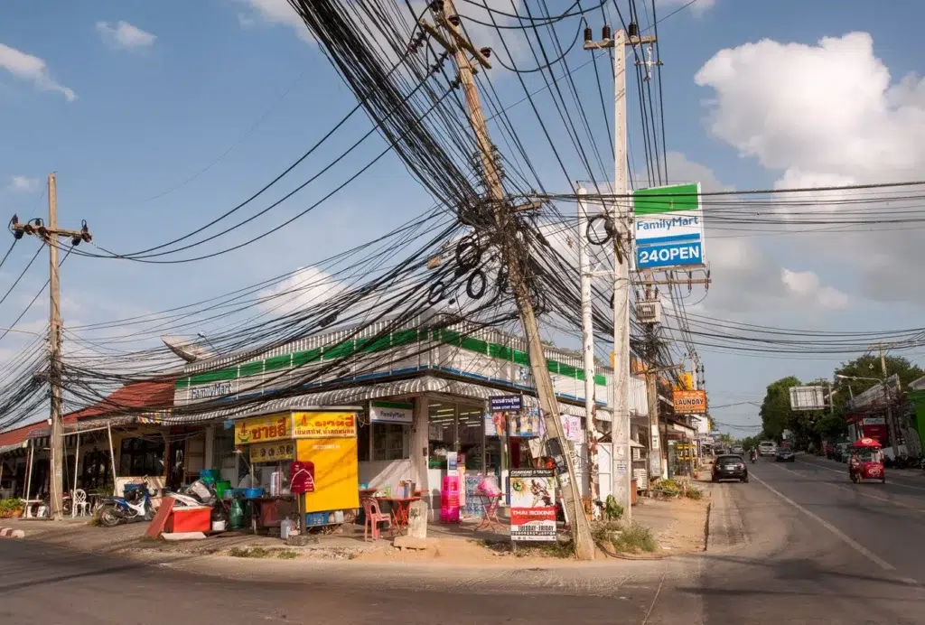 Overhead power line, Urban area, Overhead line, documentary photography by Josh Edelson/AFP
