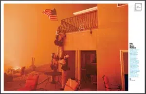 A California wildfire photographed by Josh Edelson (smoke and flames over a California neighborhood)