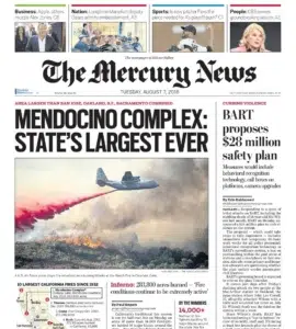 The Mercury News — flames sweeping across a California hillside, captured by Josh Edelson