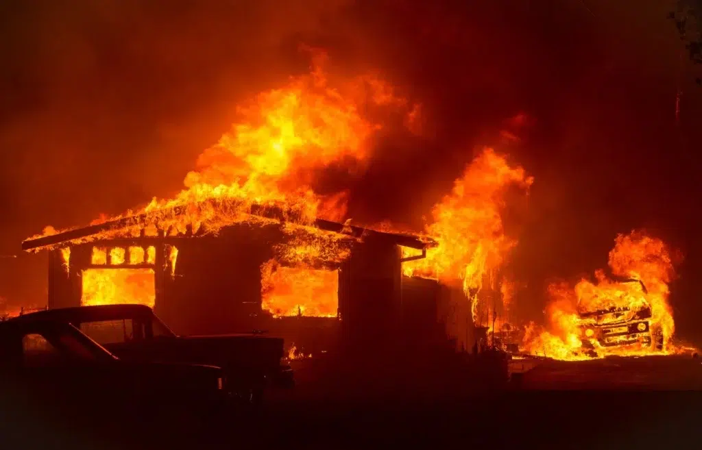 TOPSHOT - Motorists drive past flames from the "Wall Fire" along..., photo by Josh Edelson/AFP