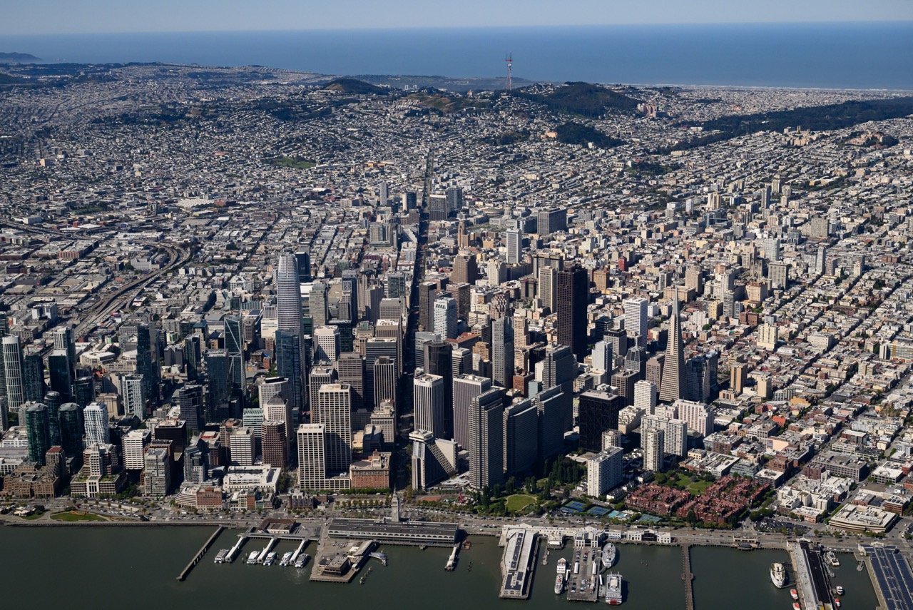 Downtown San Francisco from directly above — the Financial District, North Beach, and the Embarcadero. Photo by Josh Edelson.