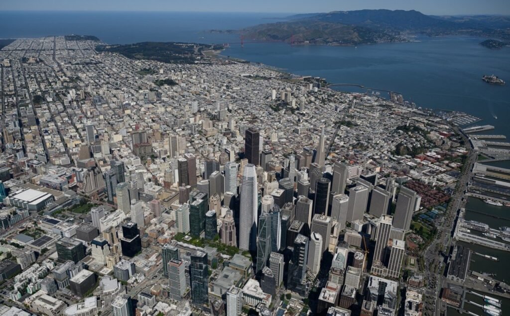 Aerial view of the dense downtown San Francisco skyline including the Financial District and Transamerica Pyramid — aerial photographer Josh Edelson