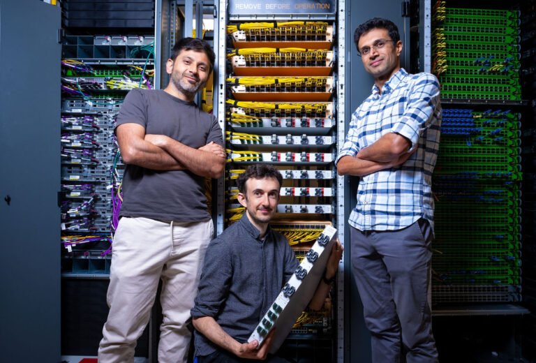 Three AWS engineers photographed inside an Amazon Web Services data center in Cupertino, California