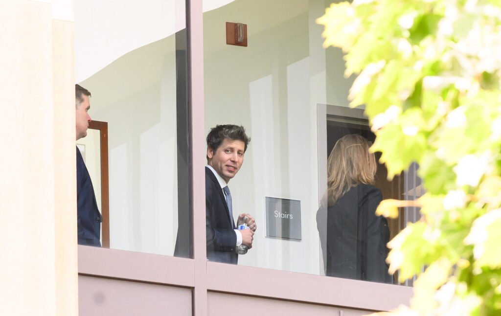 OpenAI CEO Sam Altman walks through Oakland federal courthouse during recess in the Musk vs. OpenAI trial — photo by Josh Edelson/AFP