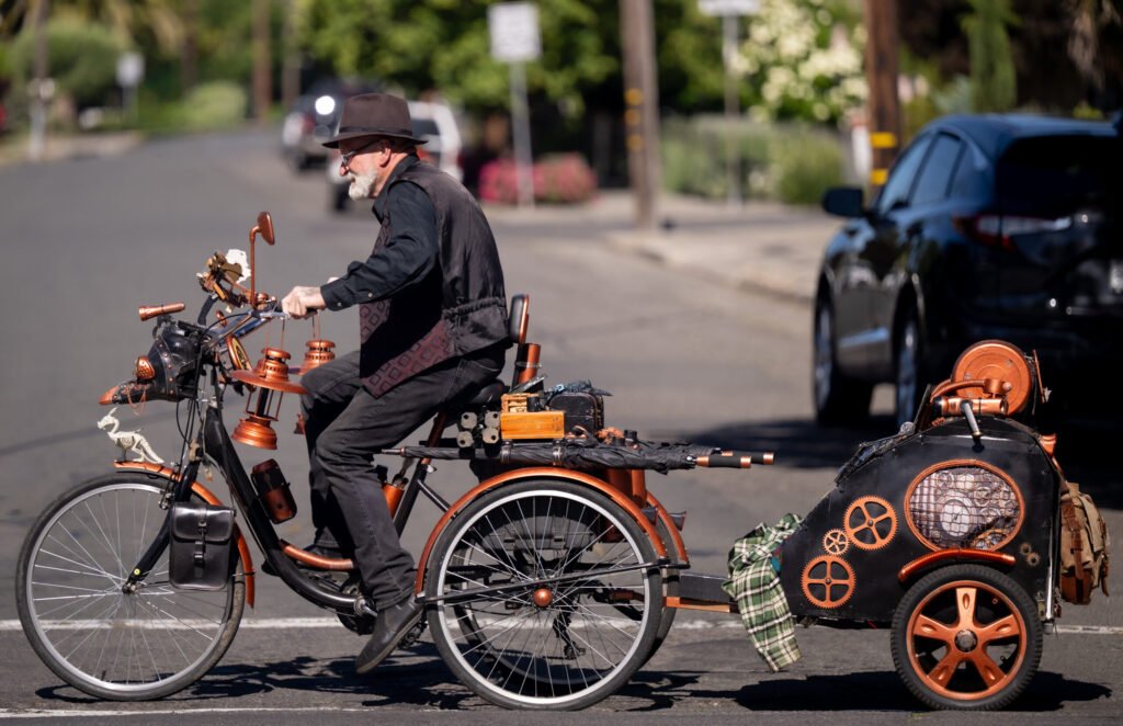 Man on an elaborate steampunk tricycle at Bike to Wherever Day in Napa, California — event photography by Josh Edelson for MTC