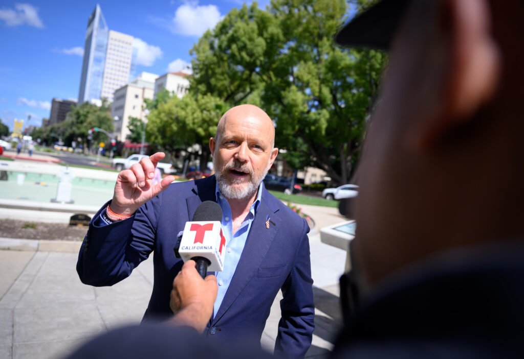 California governor candidate Steve Hilton being interviewed by a television reporter in downtown Sacramento
