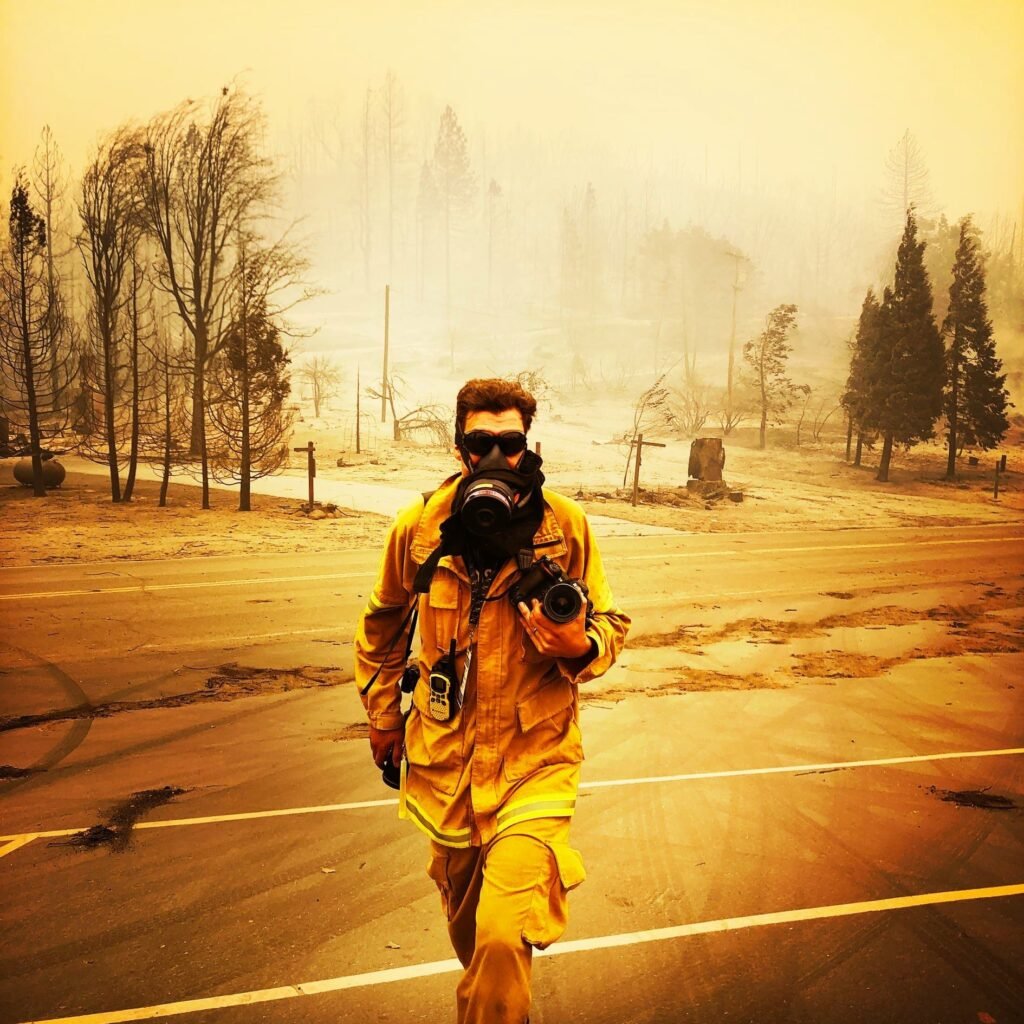 Josh Edelson photographing a California wildfire on assignment for AFP — award-winning wildfire photojournalism
