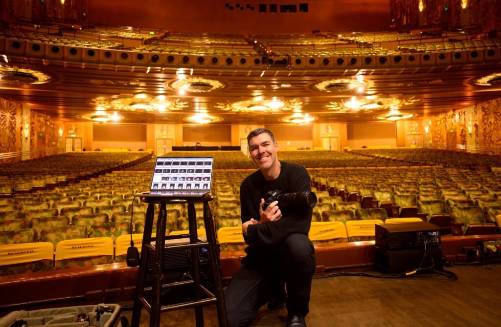 Josh Edelson presenting on stage before a show