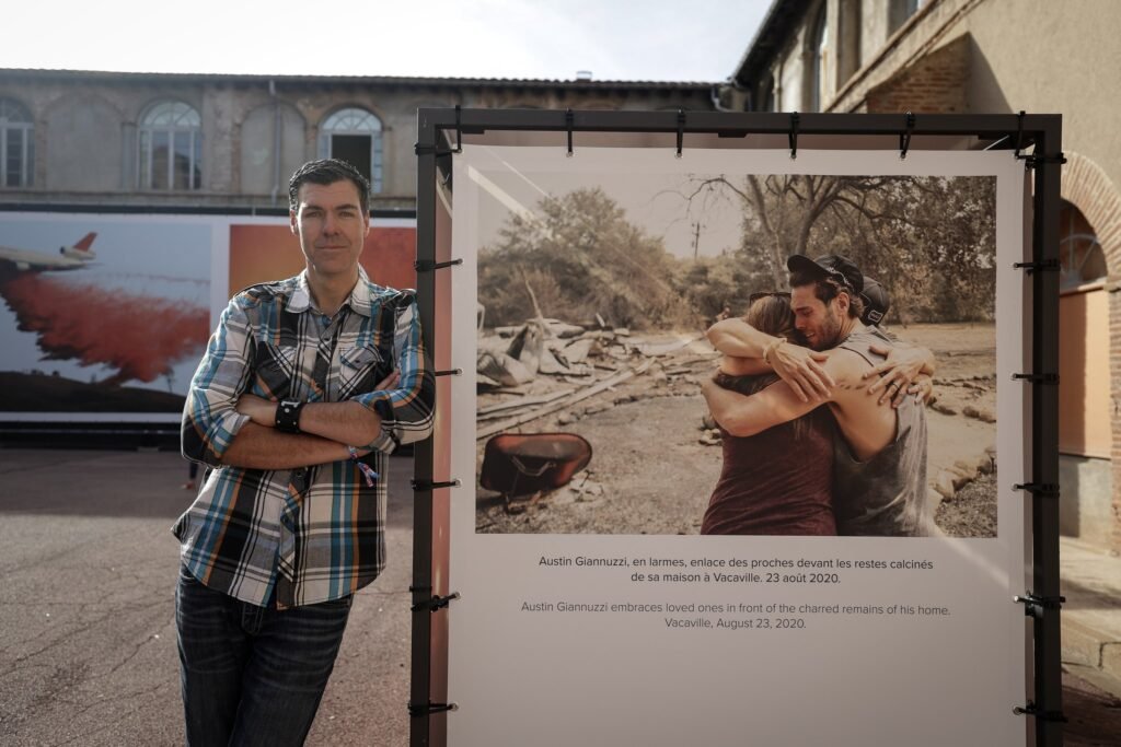 Josh Edelson at his Visa pour l'Image wildfire exhibition