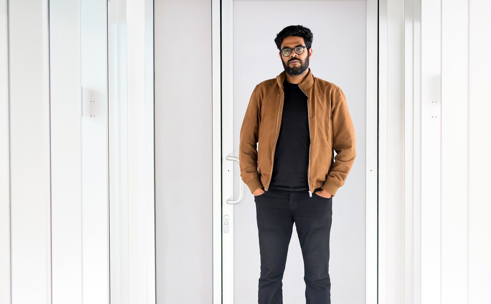 Amit Jain in Luma AI's bright, almost entirely white office in Palo Alto, with nowhere for a shadow to live