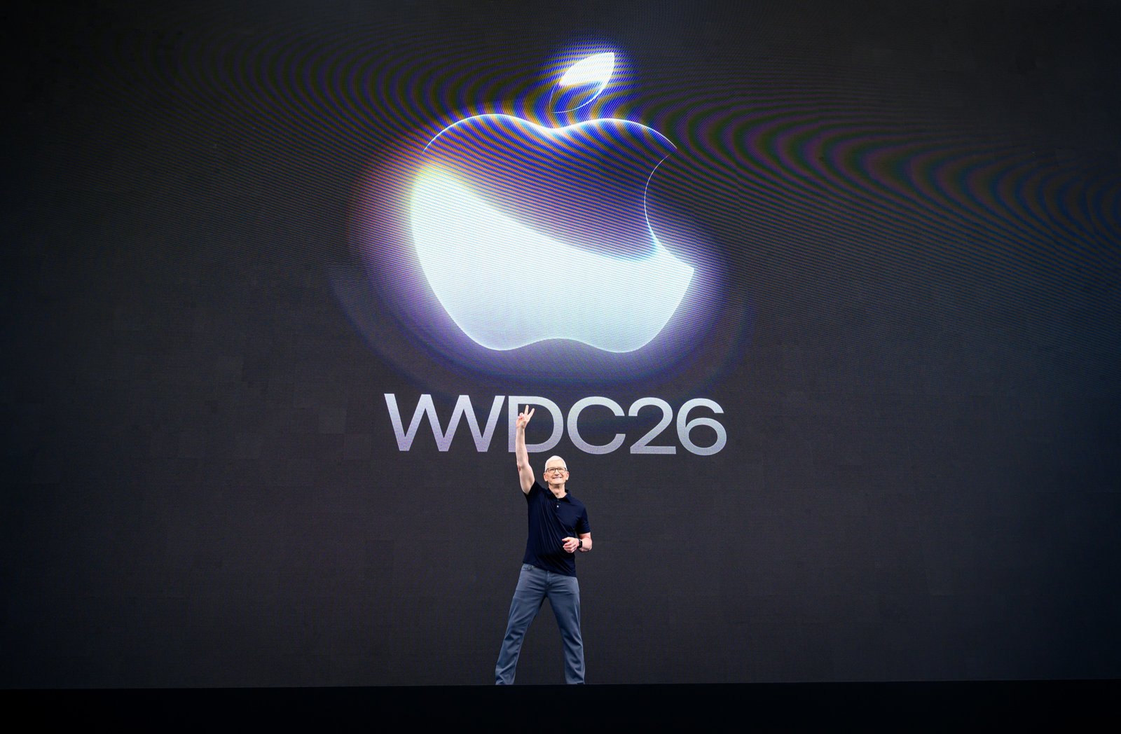 San Francisco corporate event photographer Josh Edelson's photo of Apple CEO Tim Cook on stage beneath the Apple logo and WWDC26 sign at the 2026 keynote