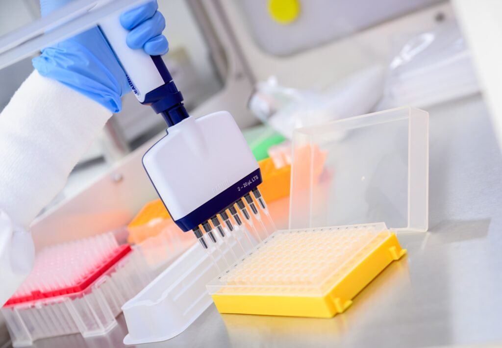 Scientist at work in a life sciences laboratory in San Francisco, biotech photography by Josh Edelson