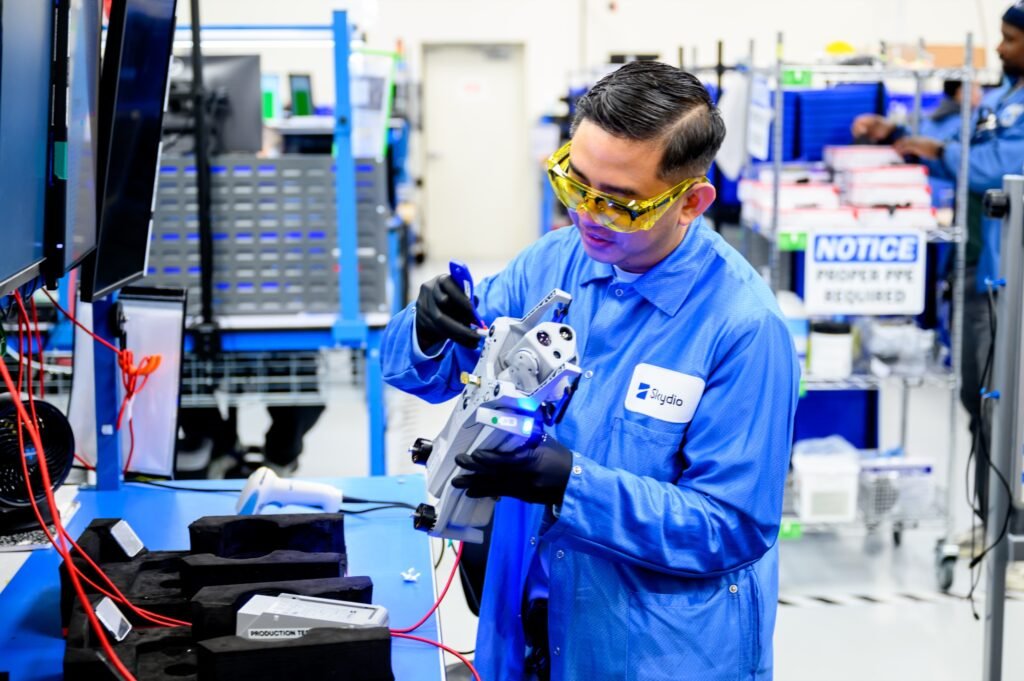 Technician inspecting a drone on the production line, corporate and industrial lifestyle photography in the San Francisco Bay Area