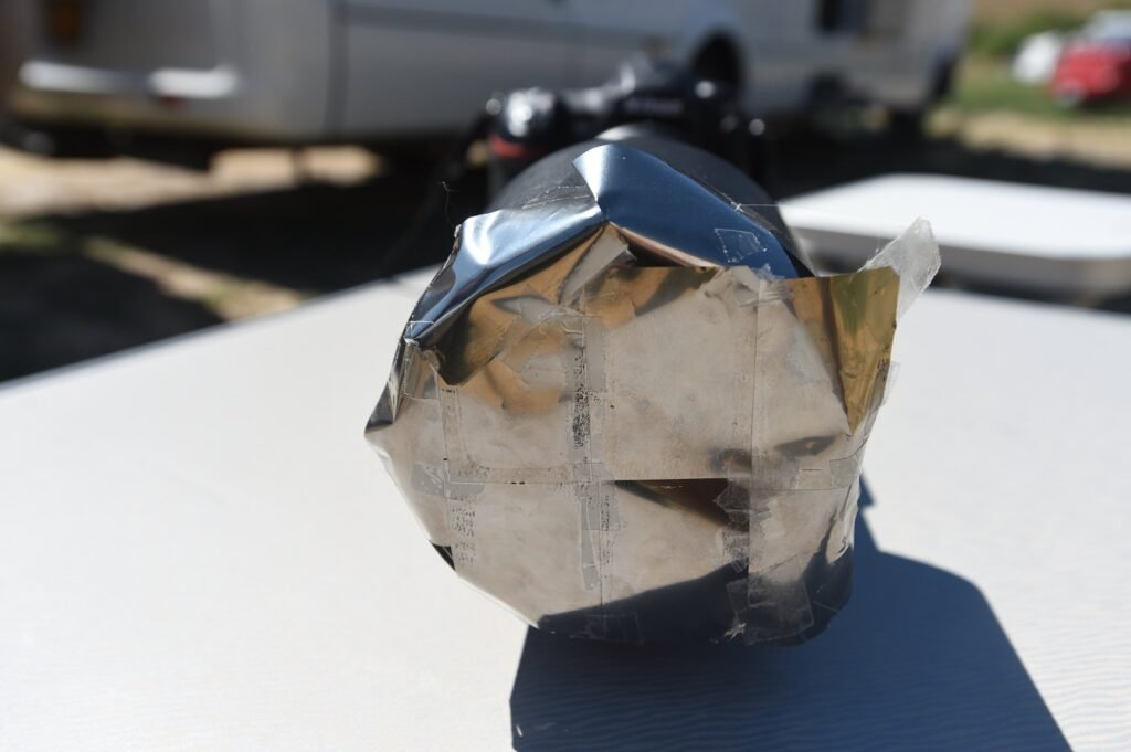 A makeshift solar filter made from taped-together eclipse glasses, by Josh Edelson