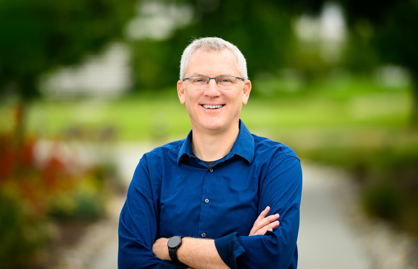 BigPanda executive team headshot with a blurred park background, photographed by Josh Edelson in Redwood City, California