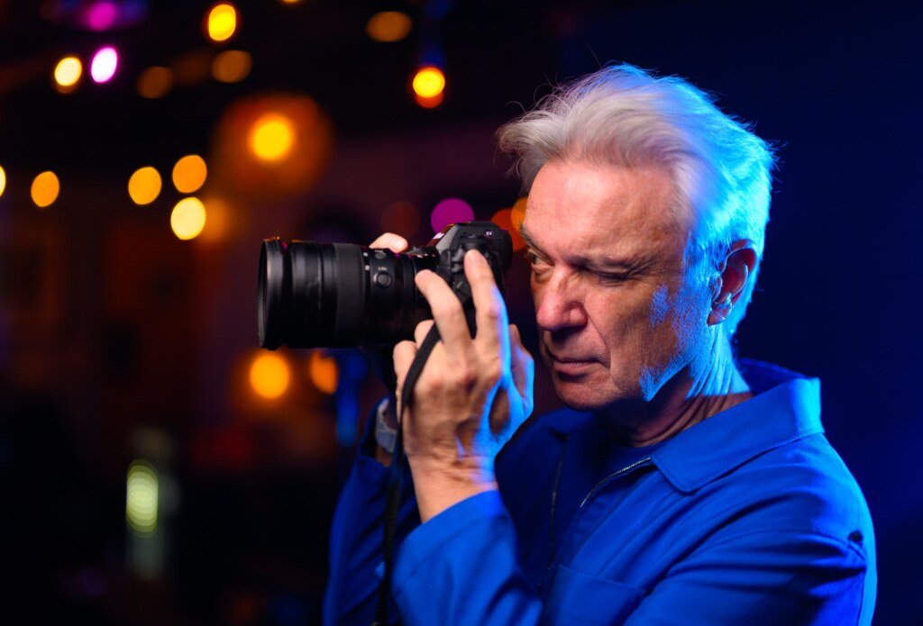 David Byrne turns the tables with the photographer's camera backstage at the Greek Theatre in Berkeley. (Josh Edelson / LA Times)