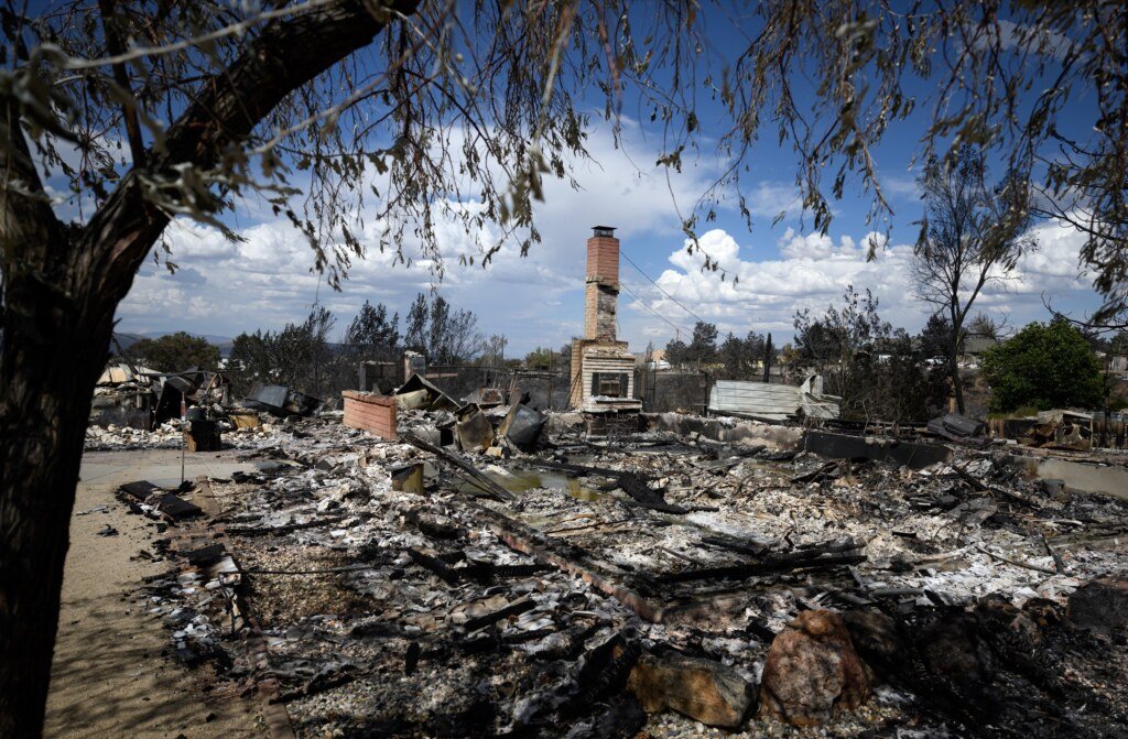 A burned home smolders during the Hawk Fire in Reno, Nevada, August 24, 2026. (Josh Edelson / AFP)