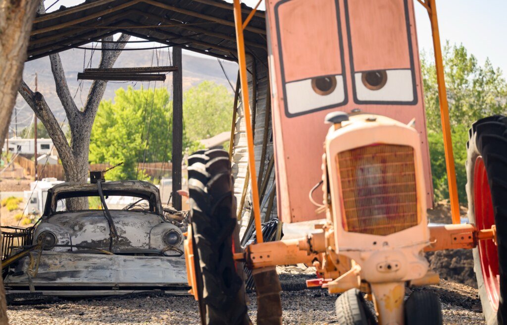 Vehicles themed after the movie Cars sit damaged by fire during the Hawk Fire in Reno, Nevada, August 24, 2026. (Josh Edelson / AFP)