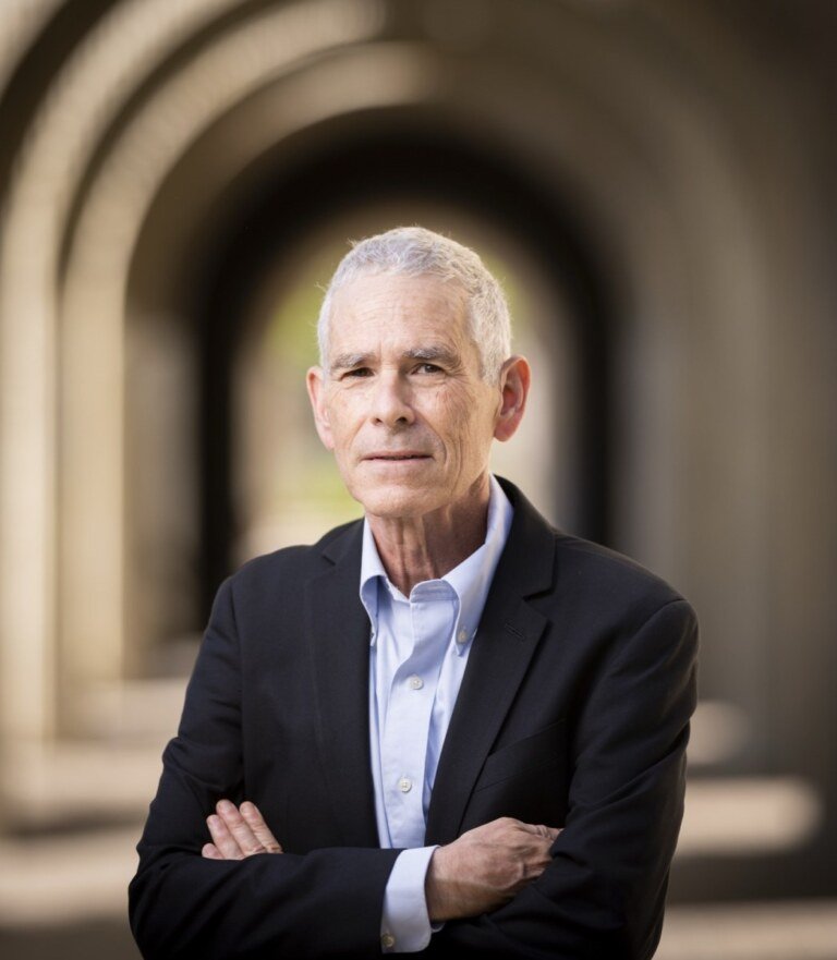 Joseph Bankman, Stanford Law professor, editorial portrait by Josh Edelson under the arches at Stanford University
