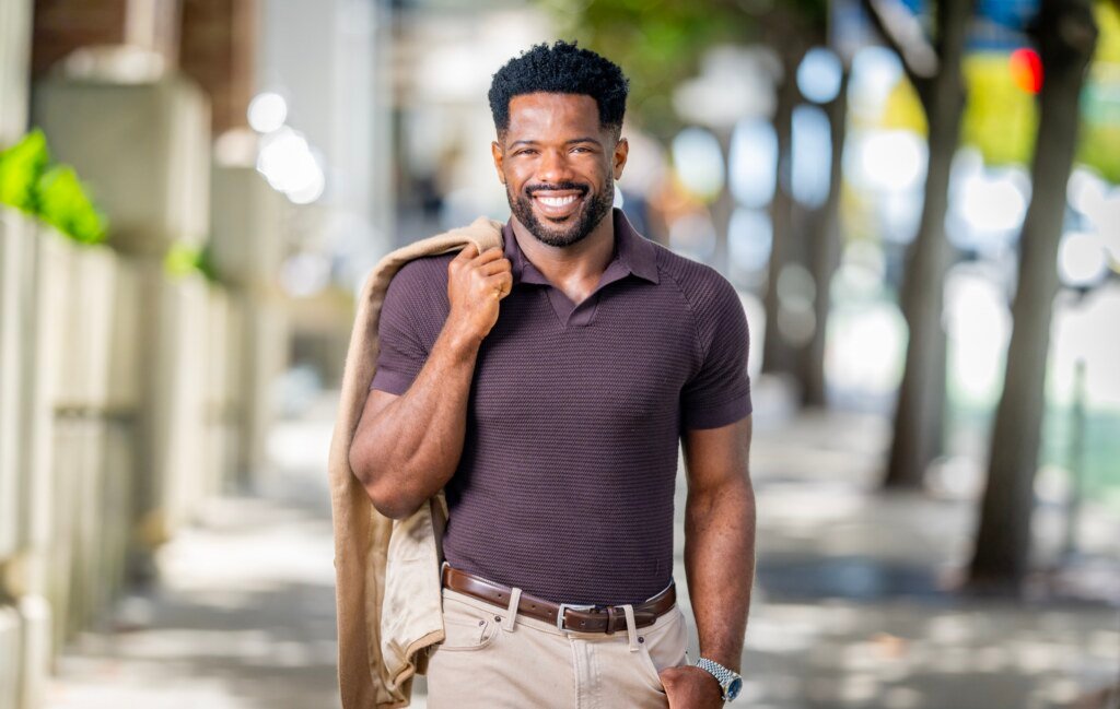 Kevin Caldwell, CEO of Ossium Health, walking portrait with jacket over shoulder in San Francisco, photographed by Josh Edelson