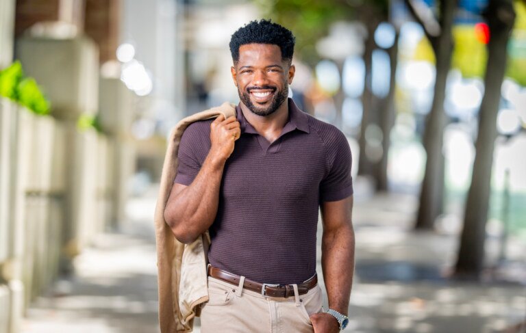 Kevin Caldwell, CEO of Ossium Health, walking portrait with jacket over shoulder in San Francisco, photographed by Josh Edelson