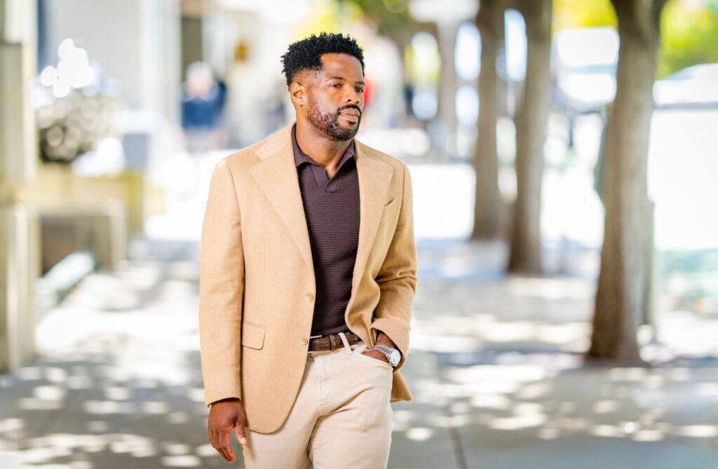 Kevin Caldwell, CEO of Ossium Health, candid lifestyle portrait walking outside the office