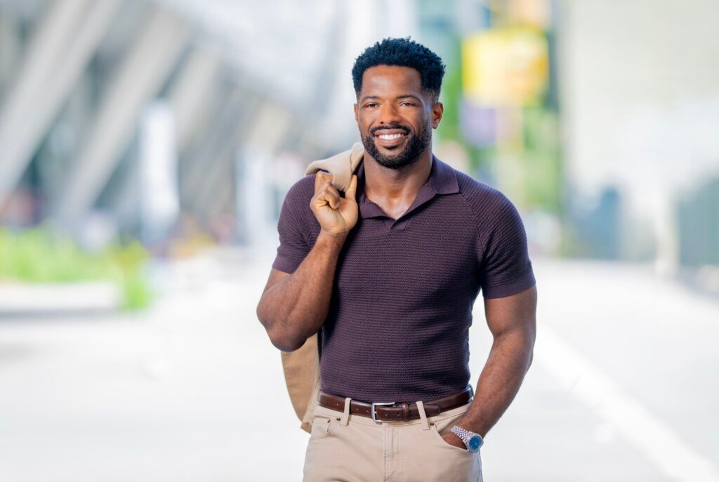 Kevin Caldwell of Ossium Health, candid walking portrait on a tree-lined San Francisco sidewalk
