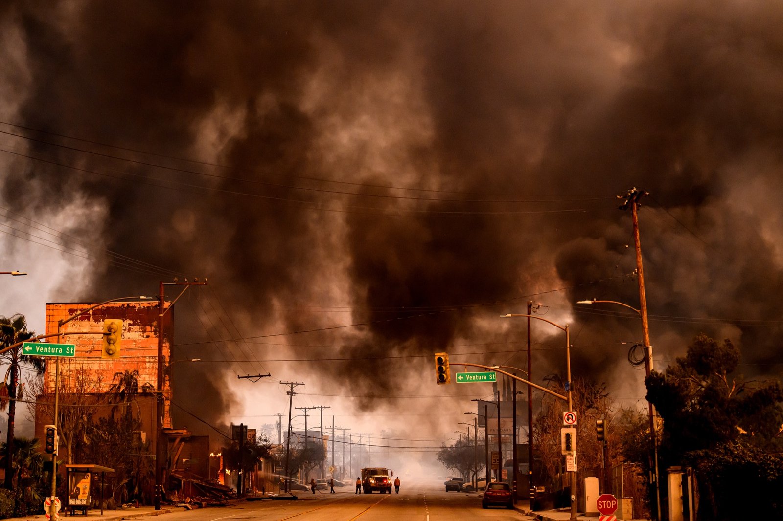 Smokes and flames overwhelms a commercial area during the Eaton fire in the Altadena area of Los Angeles County, California on January 08, 2025. (Josh Edelson / AFP)