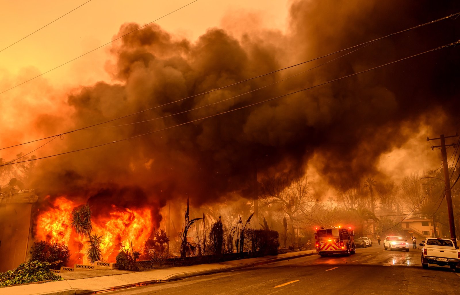 An apartment building burns during the Eaton fire in the Altadena area of Los Angeles county, California on January 08, 2025. (Josh Edelson / AFP)