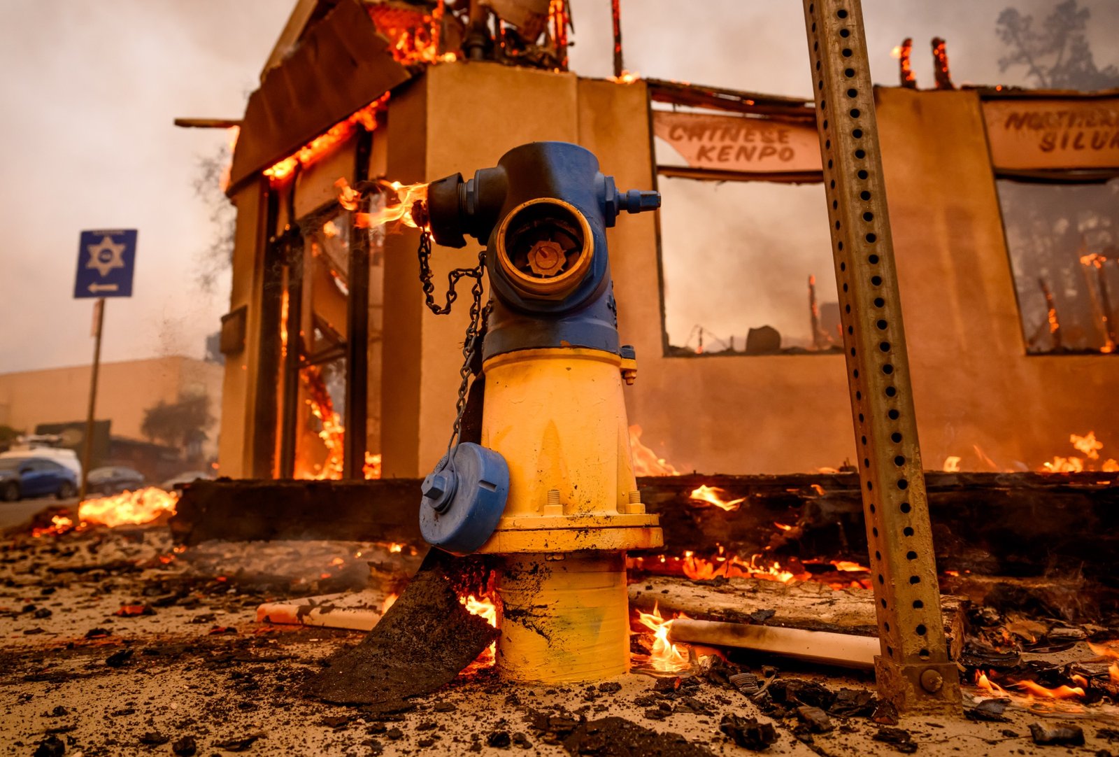 A fire hydrant burns along Lake Ave during the Eaton fire in the Altadena area of Los Angeles county, California on January 08, 2025. (Josh Edelson / AFP)