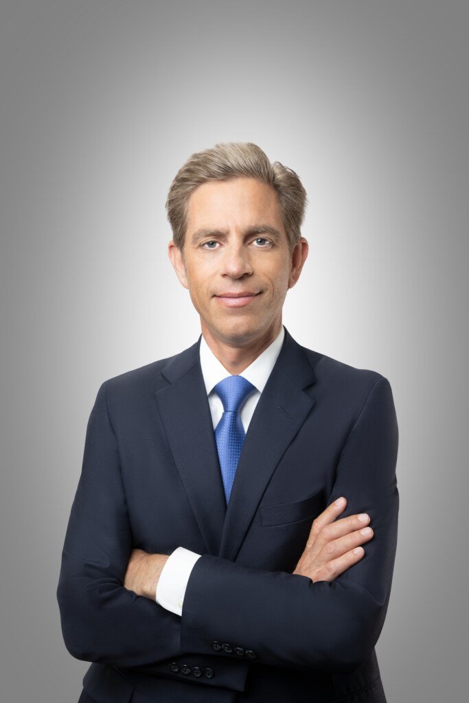Law firm partner headshot on gray studio background, San Francisco attorney headshot by Josh Edelson