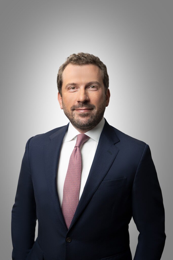 Attorney partner headshot on gray background, law firm headshot photography San Francisco
