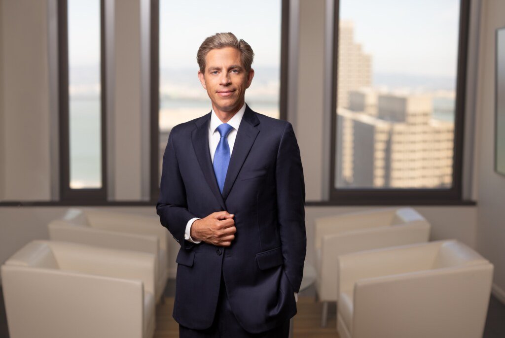 Environmental law firm partner portrait with San Francisco Bay views at the Transamerica Pyramid