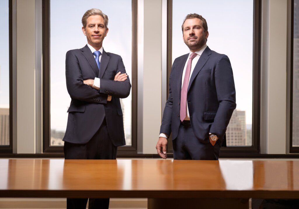 Two law firm partners photographed together at a conference table, Transamerica Pyramid San Francisco