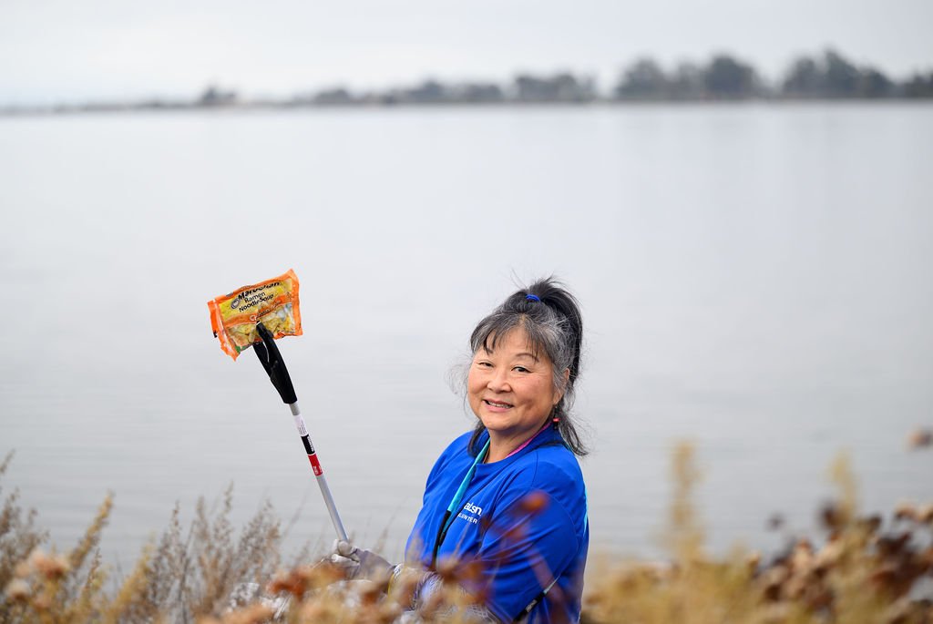 Matson employees volunteering on California Coastal Cleanup Day along the Oakland shoreline, corporate volunteer photography by Josh Edelson
