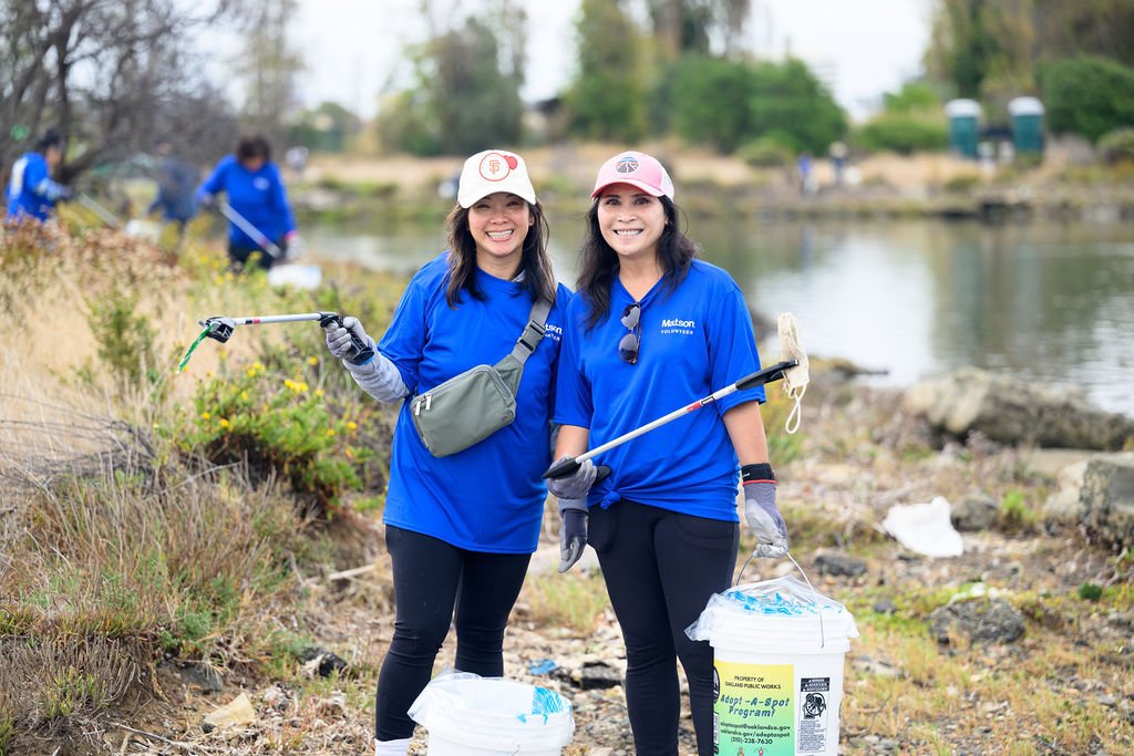 Matson employees volunteering on California Coastal Cleanup Day along the Oakland shoreline, corporate volunteer photography by Josh Edelson