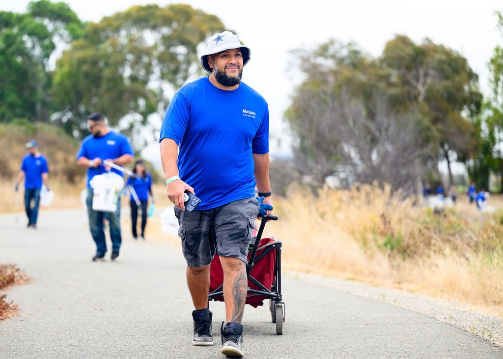 Matson employees volunteering on California Coastal Cleanup Day along the Oakland shoreline, corporate volunteer photography by Josh Edelson