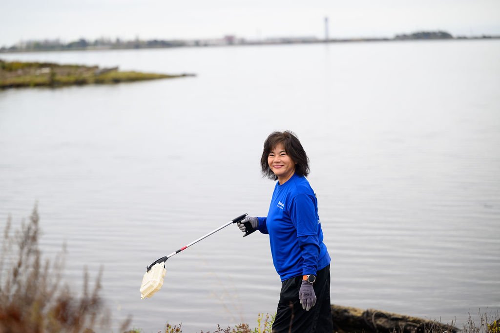 Matson employees volunteering on California Coastal Cleanup Day along the Oakland shoreline, corporate volunteer photography by Josh Edelson