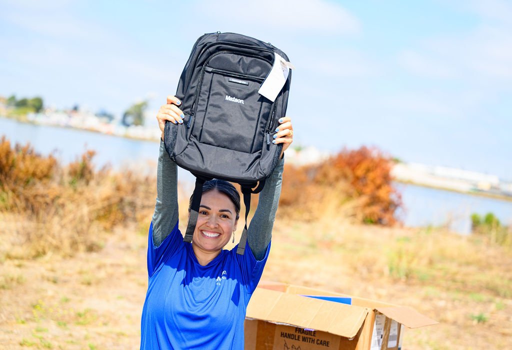 Matson employees volunteering on California Coastal Cleanup Day along the Oakland shoreline, corporate volunteer photography by Josh Edelson