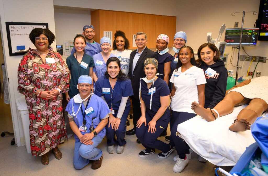 Xavier Becerra, then U.S. Secretary of Health and Human Services, visits the simulation center at Samuel Merritt University in Oakland, photographed by Josh Edelson