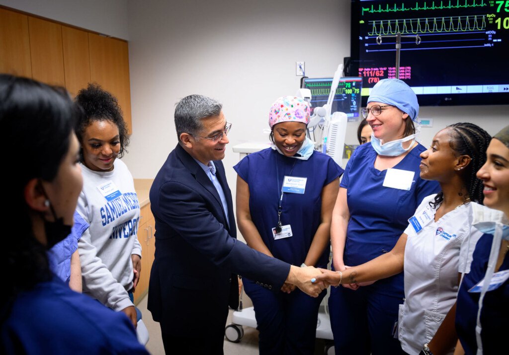 Xavier Becerra, then U.S. Secretary of Health and Human Services, visits the simulation center at Samuel Merritt University in Oakland, photographed by Josh Edelson
